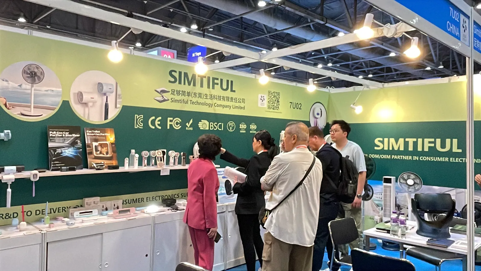 Visitors at the SIMTIFUL exhibition stand